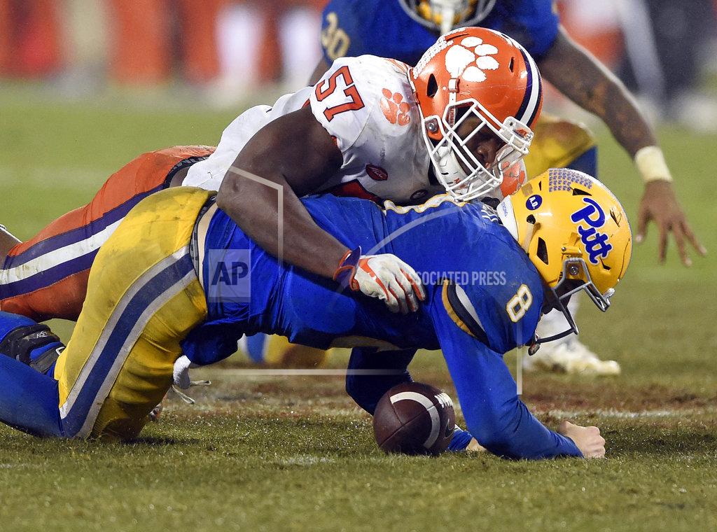Mike Mccarn Clemson's Tre Lamar (57) sacks Pittsburgh's Kenny Pickett (8) in the second half of the Atlantic Coast Conference championship NCAA college football game in Charlotte, N.C., Saturday, Dec. 1, 2018. (AP Photo/Mike McCarn)
