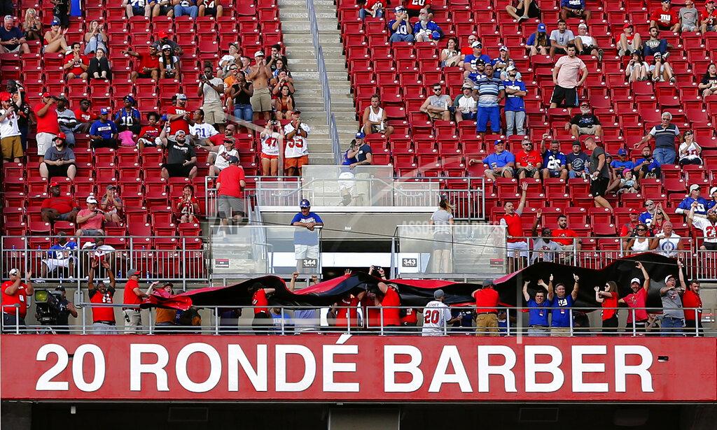 Mark Lomoglio Former Tampa Bay Buccaneers player Ronde Barber's name is uncovered after he was inducted to the team's Ring of Honor during halftime of an NFL football game against the New York Giants Sunday, Sept. 22, 2019, in Tampa, Fla. (AP Photo/Mark LoMoglio)