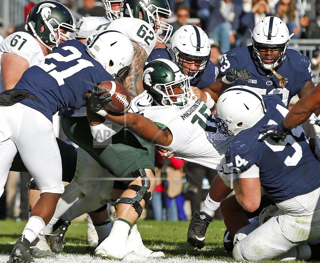 Chris Knight Michigan State's La'Darius Jefferson (15) punches it in for a touchdown against Penn State during the first half of an NCAA college football game in State College, Pa., Saturday, Oct. 13, 2018. (AP Photo/Chris Knight)