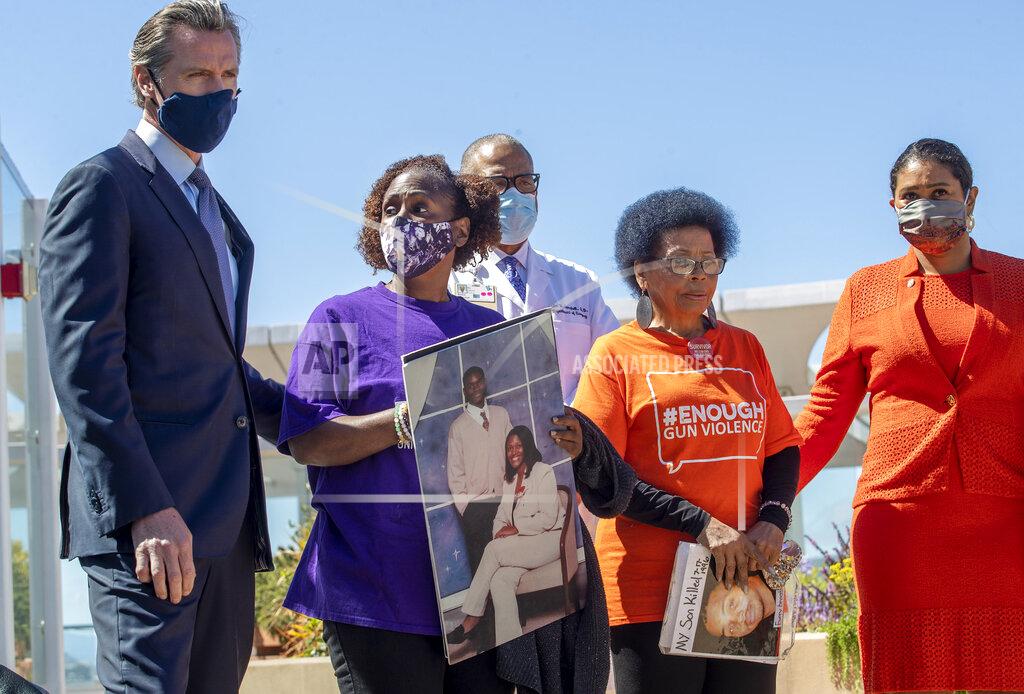 Karl Mondon California Gov. Gavin Newsom, left, and San Francisco Mayor London Breed stand with Sheila Burton and Mattie Scott of the Brady Center to Prevent Gun Violence during a press conference at Zuckerberg General Hospital in San Francisco, Thursday, June 10, 2021. Gov. Newsom denounced in starkly personal terms a federal judge's upending of the state's restrictions on assault weapons as officials announced the filing Thursday of a formal notice that they will appeal the decision. (Karl Mondon/Bay Area News Group via AP)