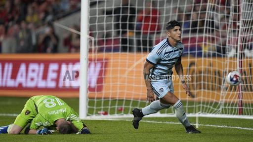 Real Salt Lake goalkeeper Zac MacMath (18) looks down after Sporting Kansas City forward Al&aacute;n Pulido scored during the second half of an MLS soccer match Saturday, Oct. 7, 2023, in Sandy, Utah. (AP Photo/Rick Bowmer)