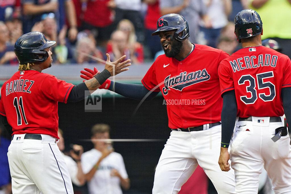 Tony Dejak Cleveland Indians' Franmil Reyes, center, is congratulated by Jose Ramirez and Oscar Mercado after hitting a three-run home run in the third inning of a baseball game against the Tampa Bay Rays, Thursday, July 22, 2021, in Cleveland. (AP Photo/Tony Dejak)