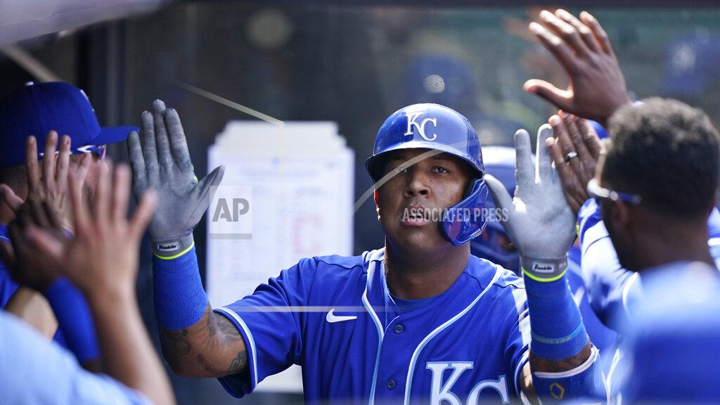 Tony Dejak Kansas City Royals' Salvador Perez is congratulated by teammates after hitting a solo home run off Cleveland Indians starting pitcher Shane Bieber in the fourth inning of a baseball game against the Cleveland Indians, Wednesday, April 7, 2021, in Cleveland. (AP Photo/Tony Dejak)