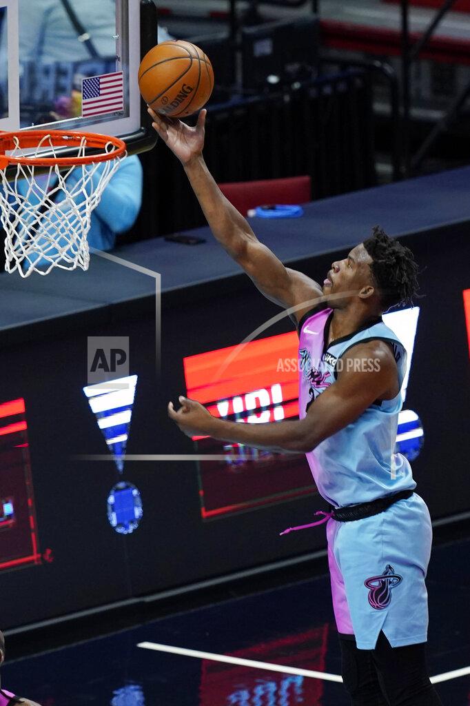 Marta Lavandier Miami Heat forward Jimmy Butler (22) drives to the basket during the first half of an NBA basketball game against the Sacramento Kings, Saturday, Jan. 30, 2021, in Miami. (AP Photo/Marta Lavandier)