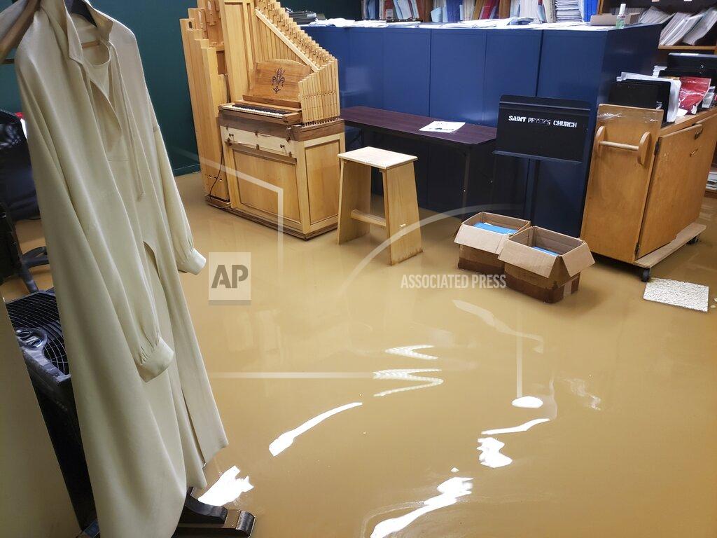 Uncredited This Monday, Jan. 4, 2020 photo provided by Saint Peter's Lutheran Church shows flood damage in their church in the Manhattan borough of New York after a water main break. The Lutheran church was already reeling from the COVID-19 deaths of more than 60 congregation members during the pandemic. (Saint Peter's Lutheran Church via AP)