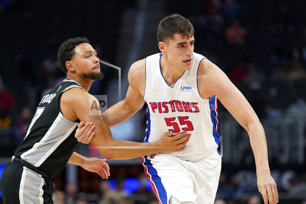 Carlos Osorio Detroit Pistons center Luka Garza (55) checks San Antonio Spurs guard Bryn Forbes (7) during the second half of a preseason NBA basketball game, Wednesday, Oct. 6, 2021, in Detroit. (AP Photo/Carlos Osorio)