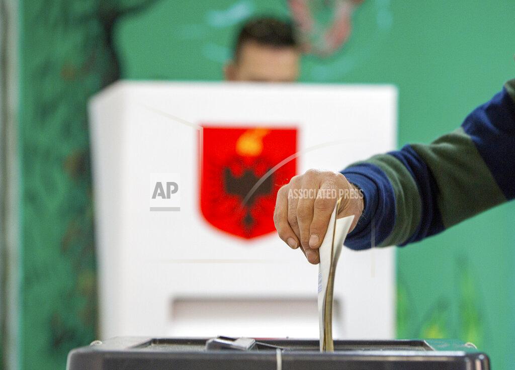 Visar Kryeziu A man casts his vote during parliamentary elections in capital Tirana, Albania, Sunday, April 25, 2021. Albanian voters have started casting ballots in parliamentary elections on Sunday amid the virus pandemic and a bitter political rivalry between the country's two largest political parties. (AP Photo/Visar Kryeziu)