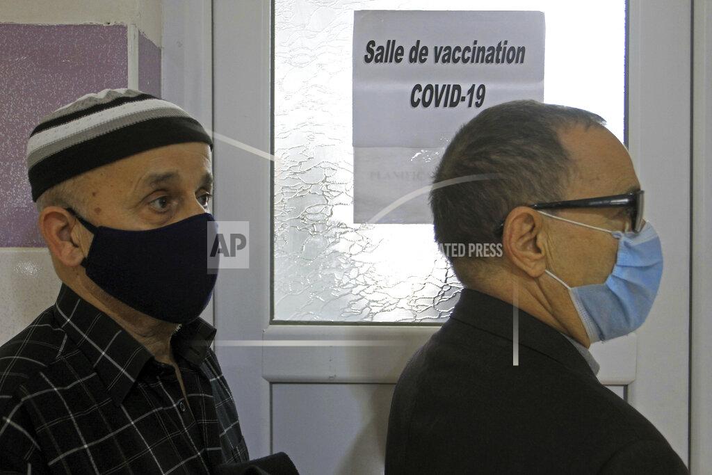 Fateh Guidoum People wait to receive the Sputnik-V COVID-19 vaccine at a vaccination center in Blida, south of Algiers, Algeria, Saturday, Jan. 30, 2021. The vaccines were delivered to the Boufarik military airport west of Algiers, Minister Amar Belhimeur said in a statement. He did not indicate how many arrived, though the government had said it had ordered a first batch of 500,000 Sputnik doses. (AP Photo/Fateh Guidoum)