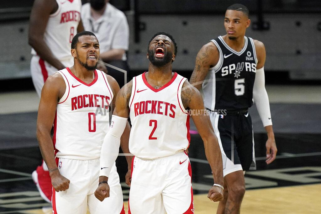 Eric Gay Houston Rockets guard Sterling Brown (0) and forward David Nwaba (2) celebrate their win over the San Antonio Spurs in an NBA basketball game in San Antonio, Thursday, Jan. 14, 2021. (AP Photo/Eric Gay)