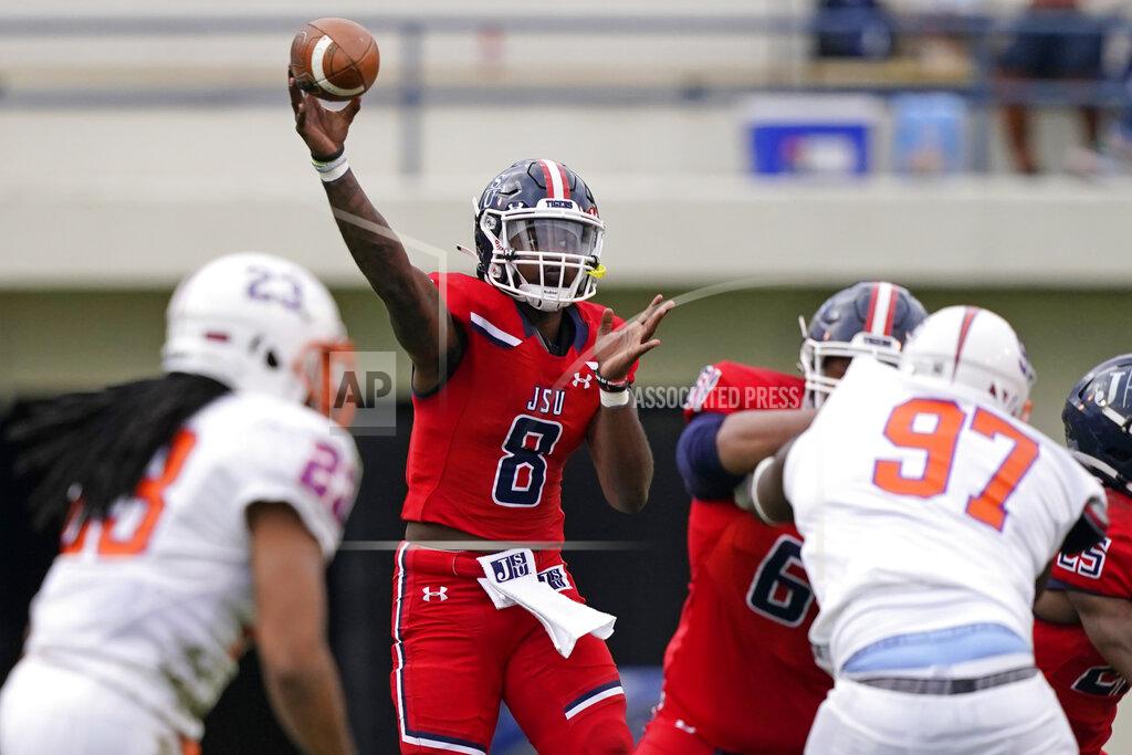 Rogelio V. Solis Jackson State quarterback Quincy Casey (8) passes against Edward Waters during the second half of an NCAA college football game in Jackson, Miss., Sunday, Feb. 21, 2021. Jackson State won the game, which was also the college coaching debut of Jackson State head football coach Deion Sanders. (AP Photo/Rogelio V. Solis)