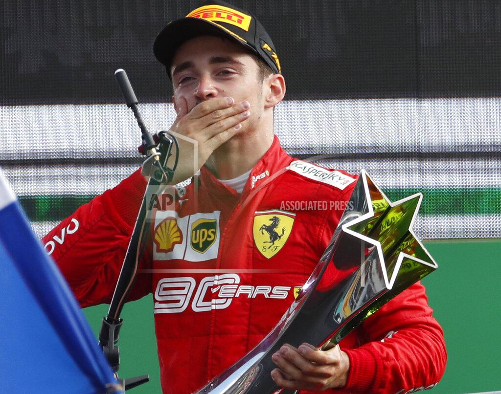 Antonio Calanni Ferrari driver Charles Leclerc of Monaco celebrates on podium after winning the Formula One Italy Grand Prix at the Monza racetrack, in Monza, Italy, Sunday, Sept.8, 2019. (AP Photo/Antonio Calanni)