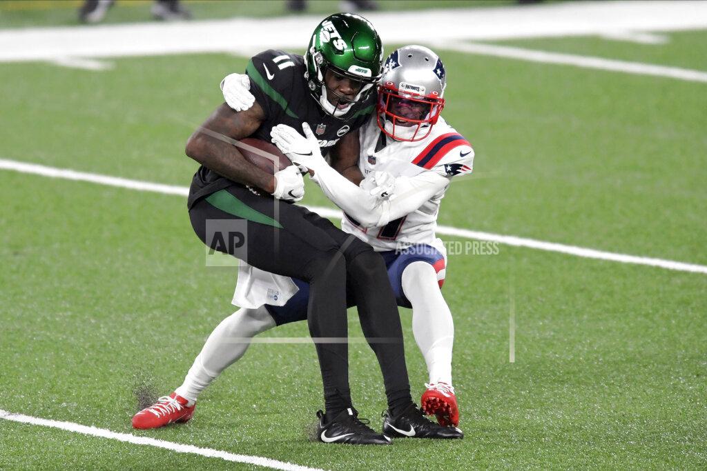Bill Kostroun New England Patriots' J.C. Jackson, right, tackles New York Jets' Denzel Mims during the first half of an NFL football game, Monday, Nov. 9, 2020, in East Rutherford, N.J. (AP Photo/Bill Kostroun)