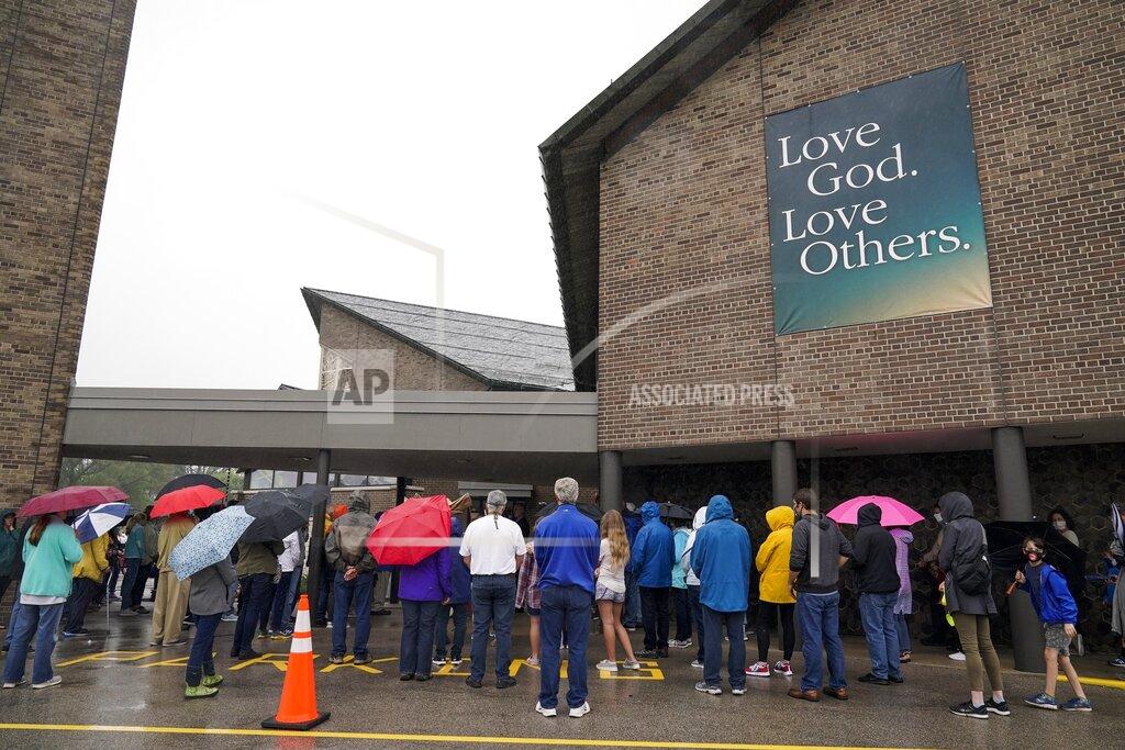 Churchgoers participate in a procession at the Holy Apostles Church in Milwaukee, Saturday, Sept. 12, 2020. For decades, Roman Catholic voters have been a pivotal swing vote in U.S. presidential elections, with a majority backing the winner, whether Republican or Democrat, nearly every time. (AP Photo/Morry Gash)