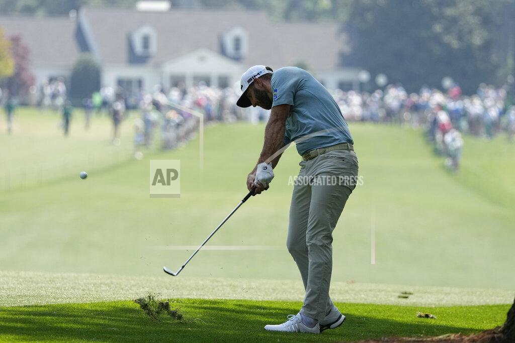 Charlie Riedel Dustin Johnson hits on the first fairway during a practice round for the Masters golf tournament on Wednesday, April 7, 2021, in Augusta, Ga. (AP Photo/Charlie Riedel)