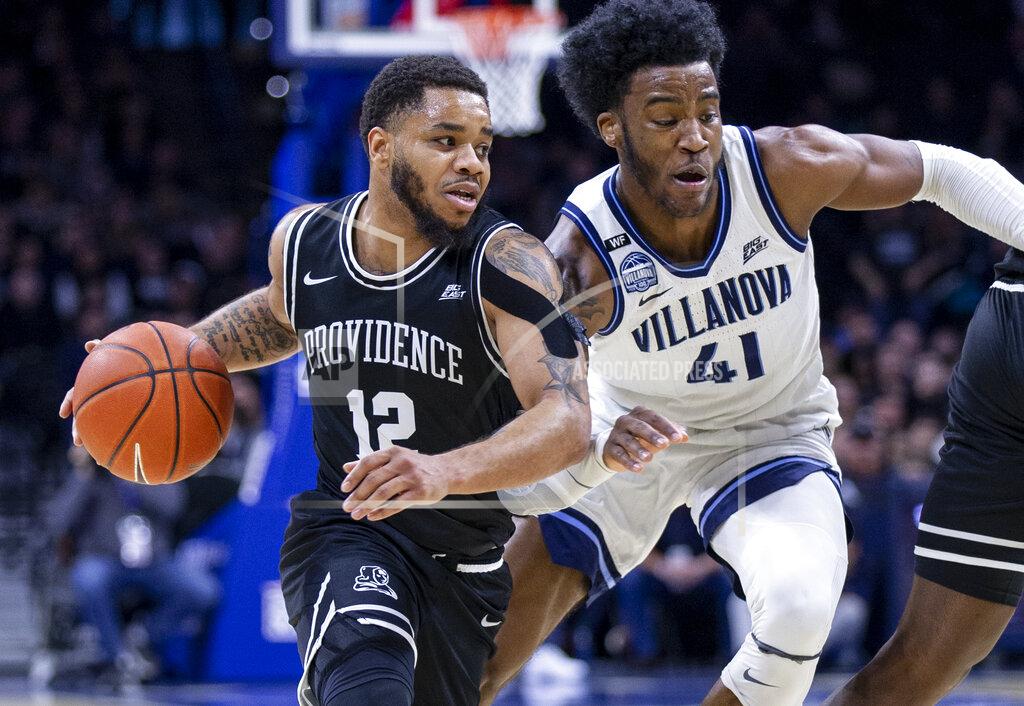 Laurence Kesterson Providence guard Luwane Pipkins (12) moves past Villanova forward Saddiq Bey (41) during the second half of an NCAA college basketball game, Saturday, Feb. 29, 2020, in Philadelphia, Pa. Providence won 58-54. (AP Photo/Laurence Kesterson)