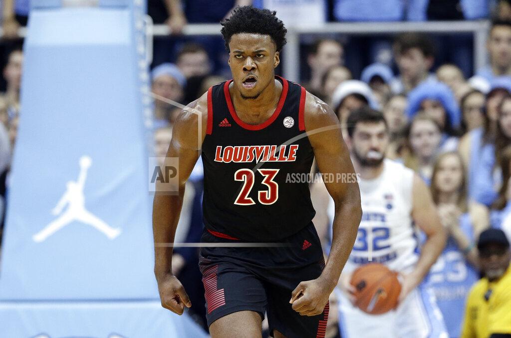 Gerry Broome Louisville's Steven Enoch (23) reacts following a basket against North Carolina during the first half of an NCAA college basketball game in Chapel Hill, N.C., Saturday, Jan. 12, 2019. (AP Photo/Gerry Broome)