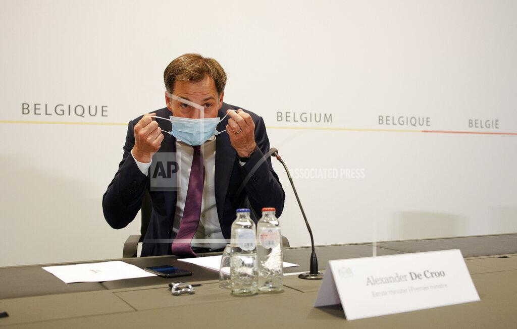 Olivier Matthys Belgium's Prime Minister Alexander De Croo prepares to speak during a media conference after a Belgian government meeting to discuss coronavirus, COVID-19, measures in Brussels, Tuesday, May 11, 2021. (AP Photo/Olivier Matthys, Pool)