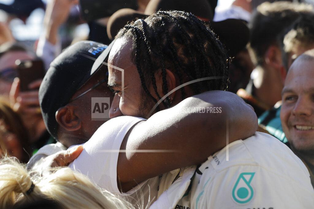 Darron Cummings Six-time world champion Mercedes driver Lewis Hamilton, of Britain, hugs his father Anthony Hamilton after the Formula One U.S. Grand Prix auto race at the Circuit of the Americas, Sunday, Nov. 3, 2019, in Austin, Texas. (AP Photo/Darron Cummings)