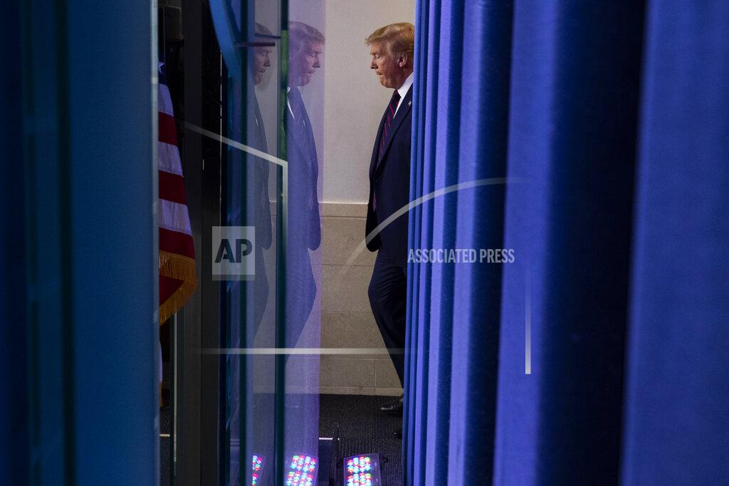 FILE - In this April 2, 2020, file photo President Donald Trump arrives to speak about the coronavirus in the James Brady Press Briefing Room of the White House in Washington. Trump is governing through the most dangerous crisis forced upon any U.S. leader since World War II. And just seven months before Election Day, he is entering a critical stretch that will determine his reelection, his legacy, and the character of the nation. (AP Photo/Alex Brandon, File)