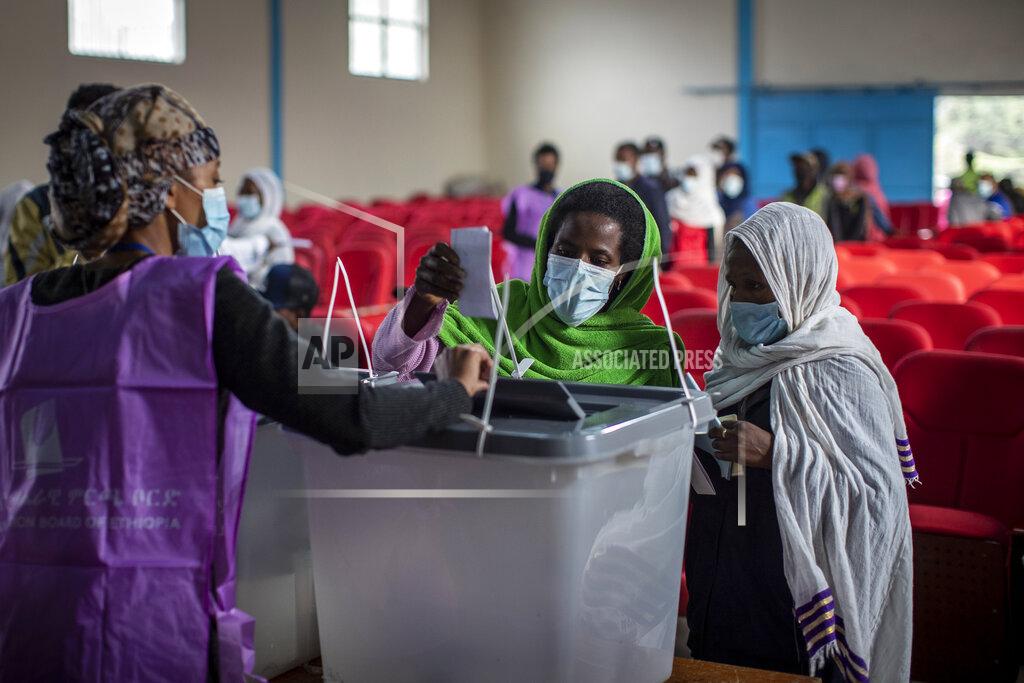 Ben Curtis Ethiopians cast their votes in the general election at a polling center in the capital Addis Ababa, Ethiopia, Monday, June 21, 2021. Ethiopia was voting Monday in the greatest electoral test yet for Prime Minister Abiy Ahmed as insecurity and logistical issues meant ballots wouldn't be cast in more than 100 constituencies of the 547 across the country. (AP Photo/Ben Curtis)