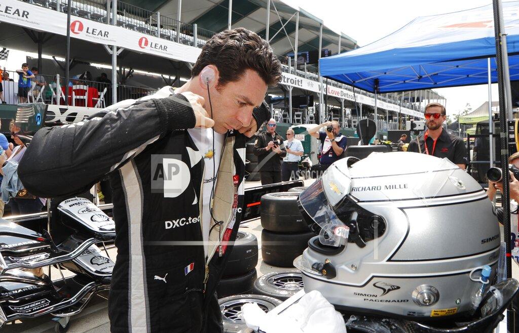 Carlos Osorio CORRECTS ID TO SIMON PAGENAUD, OF FRANCE, NOT ALEXANDER ROSSI - Simon Pagenaud, of France, suits up for a practice session for the first race of the IndyCar Detroit Grand Prix auto racing doubleheader, Friday, May 31, 2019, in Detroit. (AP Photo/Carlos Osorio)