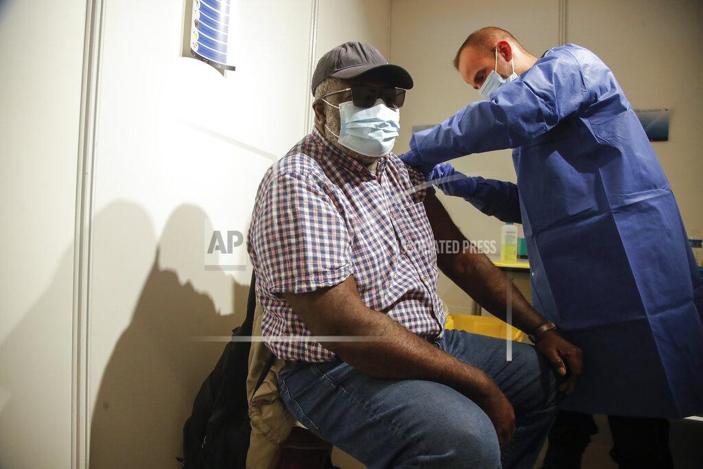 Michel Euler A man receives a Pfizer COVID-19 vaccine at a new vaccination center run by the Paris' fire brigade in Paris, Thursday, May 6, 2021. France joined the United States on Thursday in supporting an easing of patent and other protection on Covid-19 vaccines that could help poorer countries get more doses and speed the en of the pandemic. (AP Photo/Michel Euler)