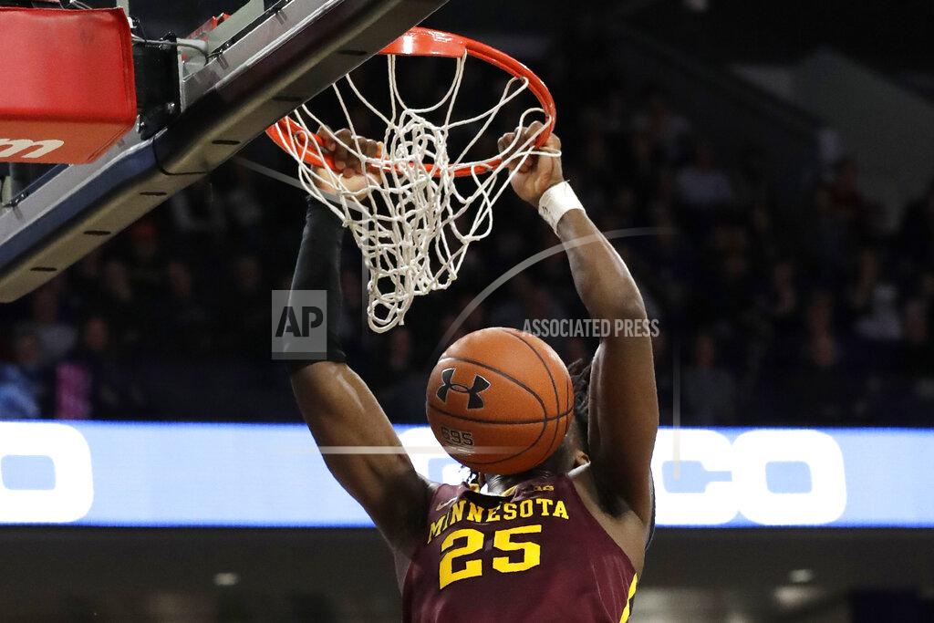 Nam Y. Huh Minnesota center Daniel Oturu dunks against Northwestern during the first half of an NCAA college basketball game in Evanston, Ill., Sunday, Feb. 23, 2020. (AP Photo/Nam Y. Huh)