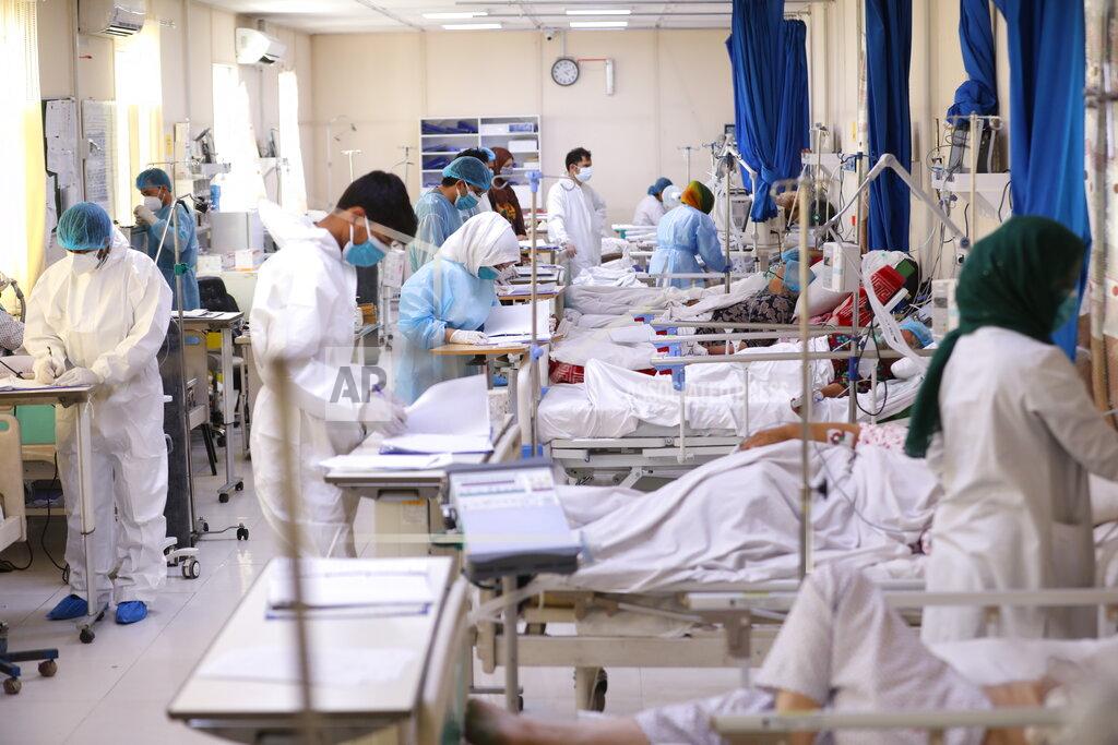 Rahmat Gul Afghan doctors check a COVID-19 patient files at the Afghan-Japan Communicable Disease Hospital in Kabul, Afghanistan, Sunday, May 30, 2021. Afghanistan is battling a brutal third wave of COVID infections, while health officials plead for vaccines, expressing deep frustration at the inequities of the global vaccine distribution. Positive COVID cases jump from eight percent to 60 per cent in some parts of the country. (AP Photo/Rahmat Gul)