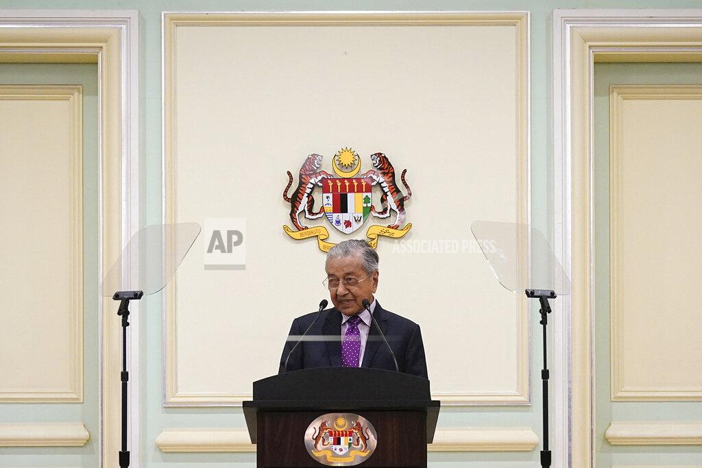 Vincent Thian FILE - In this Feb. 27, 2020, file photo, Malaysian interim leader Mahathir Mohamad speaks during a press conference at his office in Putrajaya, Malaysia. Former Prime Minister Mahathir has been ousted from his Malay party in the latest twist to a power struggle with his successor Muhyiddin Yassin, but he has vowed to challenge the move. The 94-year-old Mahathir, along with his son and three other senior members, were expelled from the Bersatu party on Thursday, May 28, 2020. (AP Photo/Vincent Thian, File)