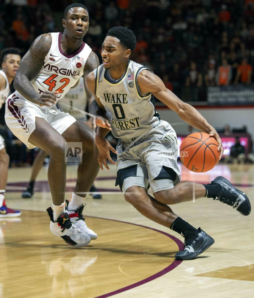 Don Petersen Wake Forest guard Brandon Childress (0) drives against Virginia Tech guard Ty Outlaw (42) during the first half of an NCAA college basketball game Saturday, Jan. 19, 2019, in Blacksburg, Va. (AP Photo/Don Petersen)