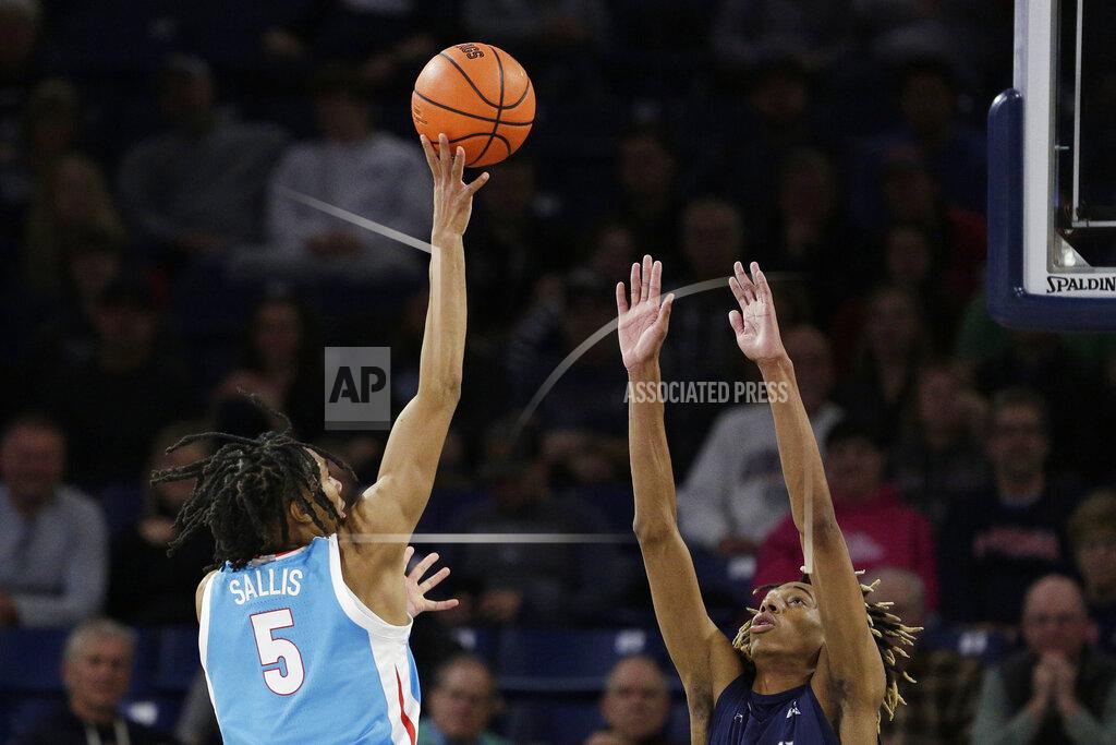 Young Kwak Gonzaga guard Hunter Sallis, left, shoots while defended by North Florida forward Jadyn Parker during the second half of an NCAA college basketball game, Monday, Nov. 7, 2022, in Spokane, Wash. Gonzaga won 104-63. (AP Photo/Young Kwak)