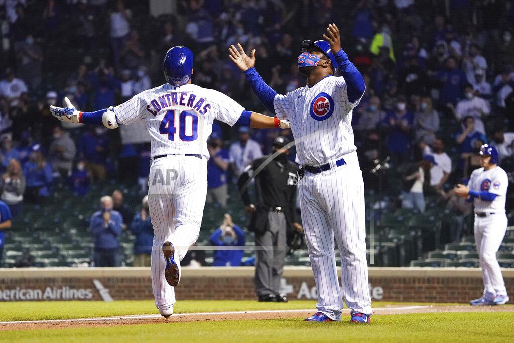 David Banks Chicago Cubs' Willson Contreras, left, and third base coach Willie Wilson, right, gesture as he runs the bases after hitting a two-run home run against the Milwaukee Brewers during the fourth inning of a baseball game, Monday, April 5, 2021, in Chicago. (AP Photo/David Banks)