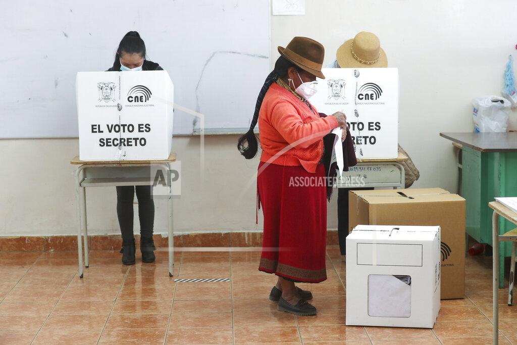 Dolores Ochoa A woman votes during general elections in Cangahua, Ecuador, Sunday, Feb. 7, 2021. Amidst the new coronavirus pandemic Ecuadoreans went to the polls in a first round presidential and legislative election. (AP Photo/Dolores Ochoa)