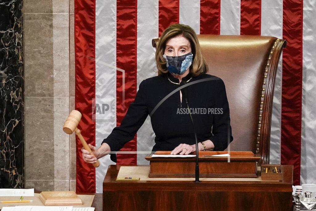 J. Scott Applewhite Speaker of the House Nancy Pelosi, D-Calif., gavels in the final vote of the impeachment of President Donald Trump, for his role in inciting an angry mob to storm the Congress last week, at the Capitol in Washington, Wednesday, Jan. 13, 2021. (AP Photo/J. Scott Applewhite)