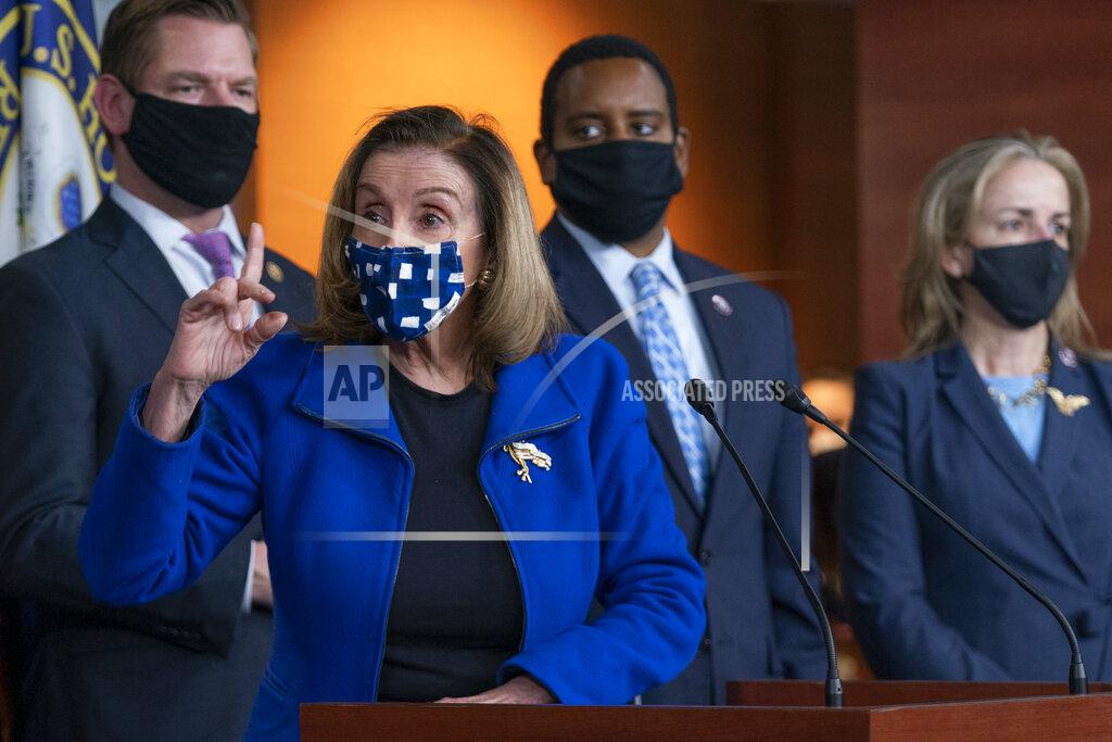 Manuel Balce Ceneta House Speaker Nancy Pelosi of Calif., with impeachment managers Rep. Eric Swalwell, D-Calif., Rep. Madeleine Dean, D-Pa., and Rep. Joe Neguse, D-Colo., speaks to members of the media during a news conference on Capitol Hill in Washington, after the U.S. Senate voted to acquit former President Donald Trump of inciting riot at U.S. Capitol, ending the impeachment trial, Saturday, Feb. 13, 2021. (AP Photo/Manuel Balce Ceneta)