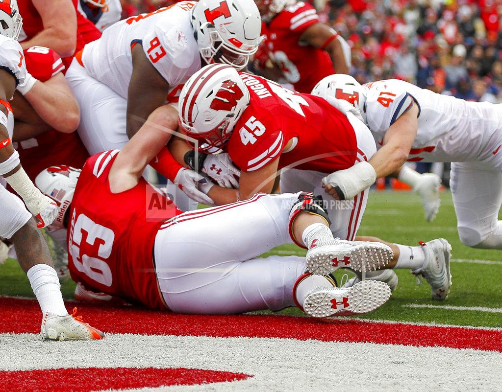 Andy Manis Wisconsin fullback Alec Ingold (45) scores against Illinois defensive lineman Calvin Avery (93) and linebacker Jimmy Marchese (41) during the first half of an NCAA college football game Saturday, Oct. 20, 2018, in Madison, Wis. (AP Photo/Andy Manis)