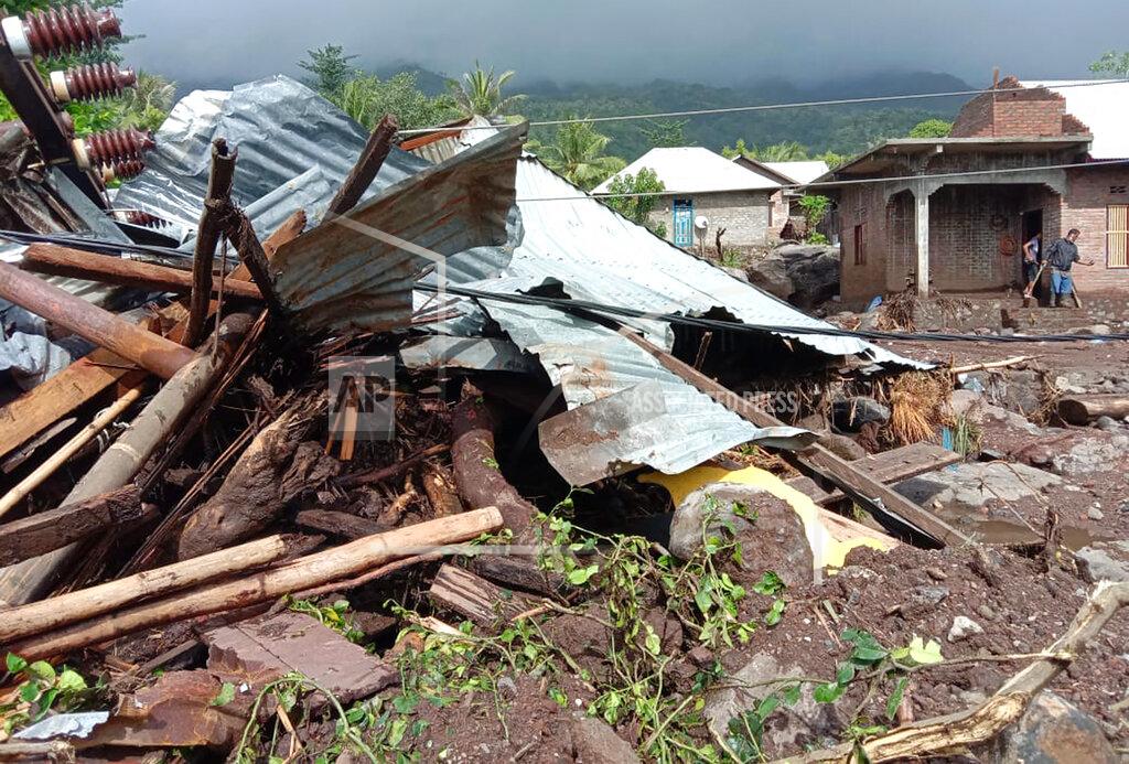 Ricko Wawo Villagers clean up mud and debris from their house following a flood in Ile Ape, on Lembata Island, East Nusa Tenggara province, Indonesia, Monday, April 5, 2021. Multiple disasters caused by torrential rains in eastern Indonesia and neighboring East Timor have left a number of people dead or missing as rescuers were hampered by damaged bridges and roads and a lack of heavy equipment Monday. (AP Photo/Ricko Wawo)