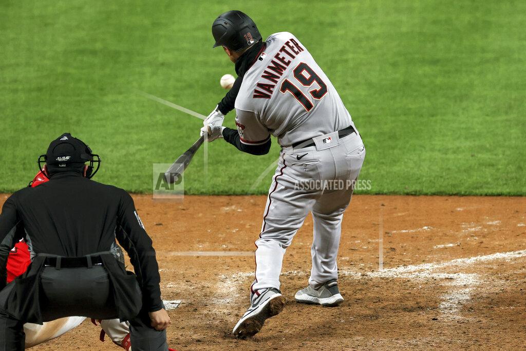 Aaron Doster Arizona Diamondbacks' Josh VanMeter hits a three-run home run during the ninth inning of a baseball game against the Cincinnati Reds, Wednesday, April 21, 2021. The Diamondbacks won 8-5. (AP Photo/Aaron Doster)