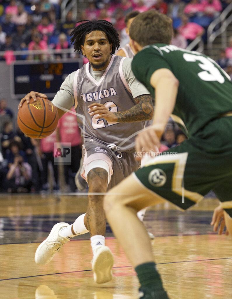 Tom R. Smedes Nevada guard Jazz Johnson (22) drives against Colorado State guard Adam Thistlewood during the first half of an NCAA college basketball game in Reno, Nev., Wednesday, Jan. 23, 2019. (AP Photo/Tom R. Smedes)