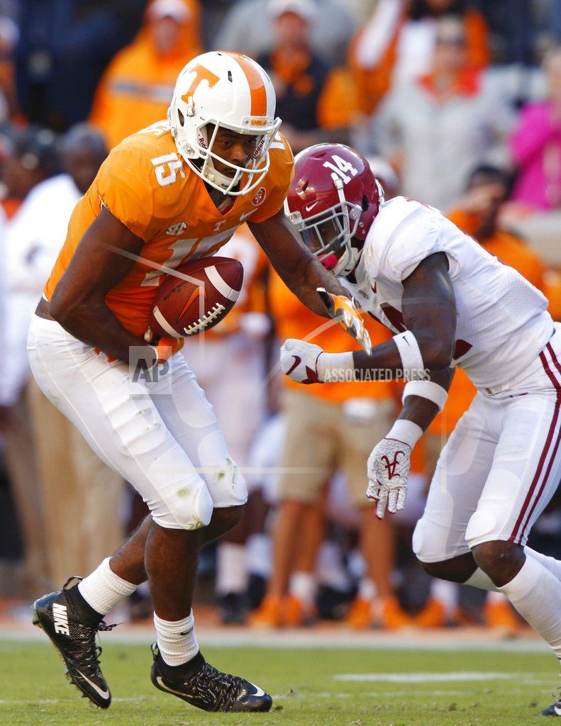 Wade Payne Tennessee wide receiver Jauan Jennings (15) fumbles the ball as he's pressured by Alabama defensive back Deionte Thompson (14) in the first half of an NCAA college football game Saturday, Oct. 20, 2018, in Knoxville, Tenn. (AP Photo/Wade Payne)
