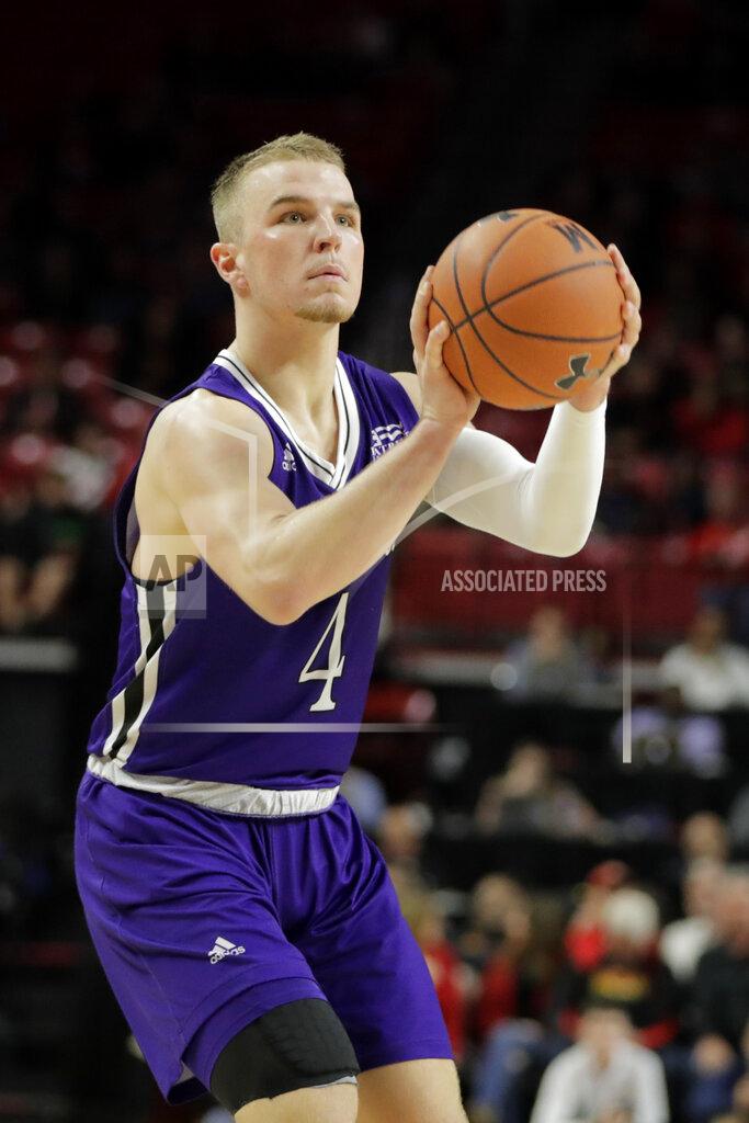 Julio Cortez Holy Cross guard Austin Butler prepares to shoot a basket against Maryland during the second half of an NCAA college basketball game, Tuesday, Nov. 5, 2019, in College Park, Md. Maryland won 95-71. (AP Photo/Julio Cortez)