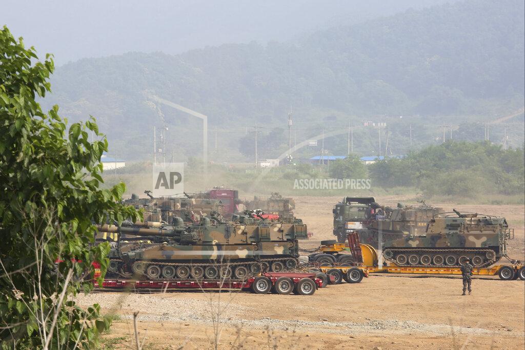 South Korean army's K-55 self-propelled howitzers are loaded on vehicles in Paju, near the border with North Korea, South Korea, Wednesday, June 17, 2020. North Korea said Wednesday it will redeploy troops to now-shuttered inter-Korean tourism and economic sites near the border with South Korea and take other steps to nullify landmark 2018 tension-reduction deals. (AP Photo/Ahn Young-joon)