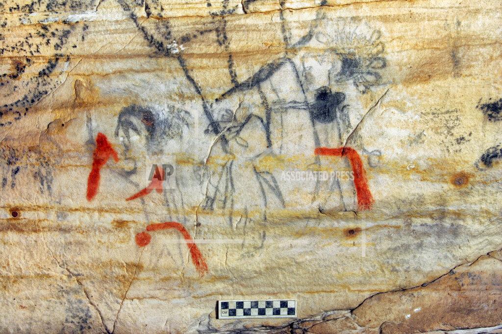 Alan Cressler This undated photo provided by Alan Cressler shows a Missouri cave featuring artwork from the Osage Nation dating more than 1,000 years was sold at auction on Tuesday, Sept. 14, 2021. The art inside "Picture Cave" shows humans, animals and mythical creatures. Experts who have studied the cave were concerned about the auction, but the director of the auction company said protections are in place to prohibit the new buyer from exploiting the cave, including a Missouri law that makes doing so a crime. (Alan Cressler via AP)