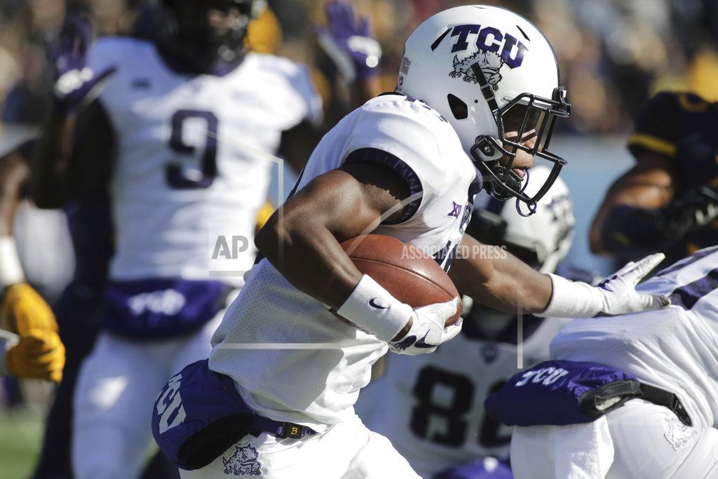 Ray Thompson TCU wide receiver Derius Davis (12) runs the ball during the first half of an NCAA college football game against West Virginia, Saturday, Nov. 10, 2018, in Morgantown, W.Va. (AP Photo/Raymond Thompson)