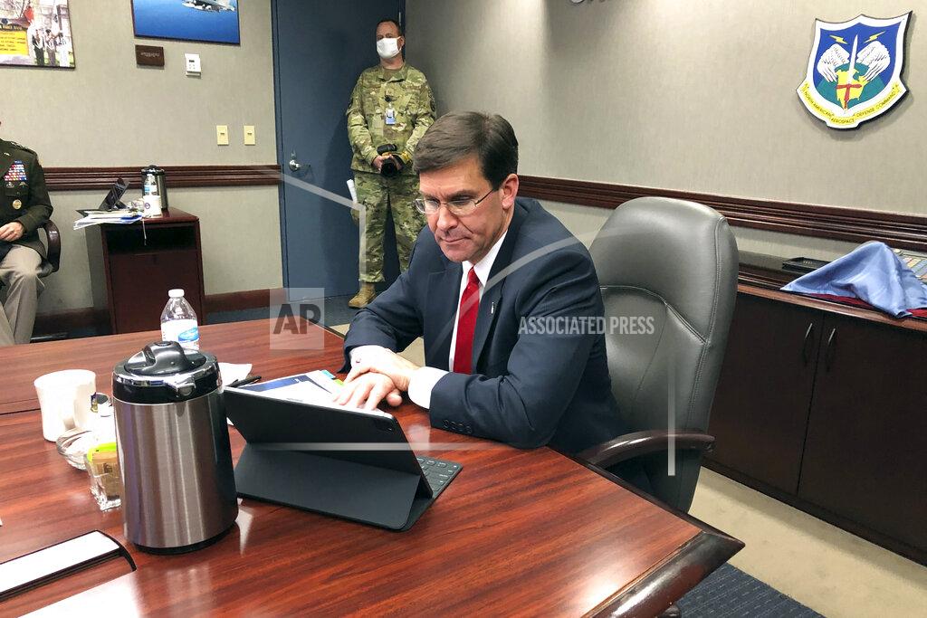 Defense Secretary Mark Esper speaks by video teleconference from U.S. Northern Command in Colorado Springs, Colo., on Thursday, May 7, 2020, with military medical specialists at civilian hospitals in New York and Connecticut. (AP Photo/Robert Burns)