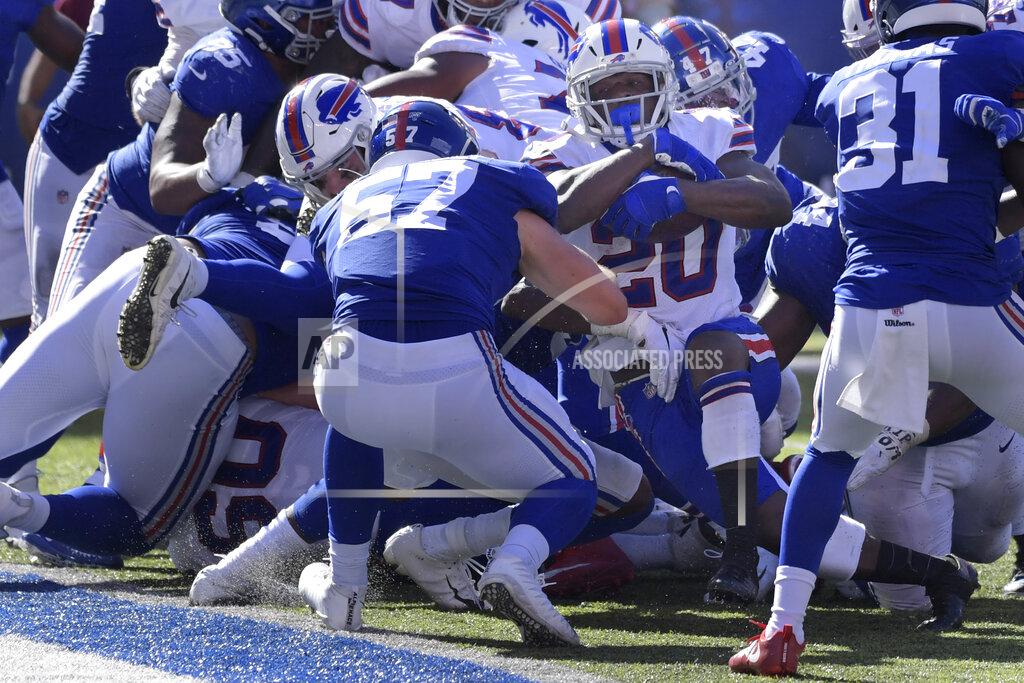 Bill Kostroun Buffalo Bills' Frank Gore (20), center right, pushes his way into the end zone during the second half of an NFL football game against the New York Giants, Sunday, Sept. 15, 2019, in East Rutherford, N.J. (AP Photo/Bill Kostroun)