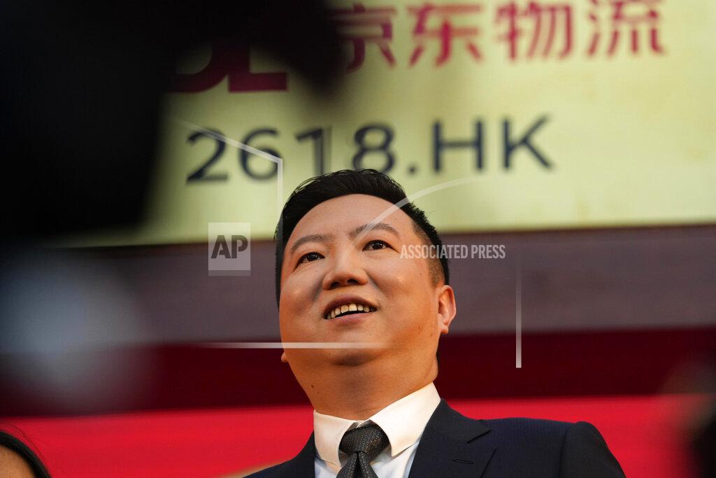 Ng Han Guan JD Logistics CEO Rui Yu attends a ceremony to virtually observe the listing of the company on the Hong Kong stock exchange from JD.com headquarters in Beijing on Friday, May 28, 2021. JD Logistics' shares jumped 14% in their trading debut Friday in Hong Kong. The company is a subsidiary of Chinese e-commerce giant JD.com. It is the latest technology company to list in the semi-autonomous Chinese city as Beijing intensifies scrutiny of the technology sector. (AP Photo/Ng Han Guan)