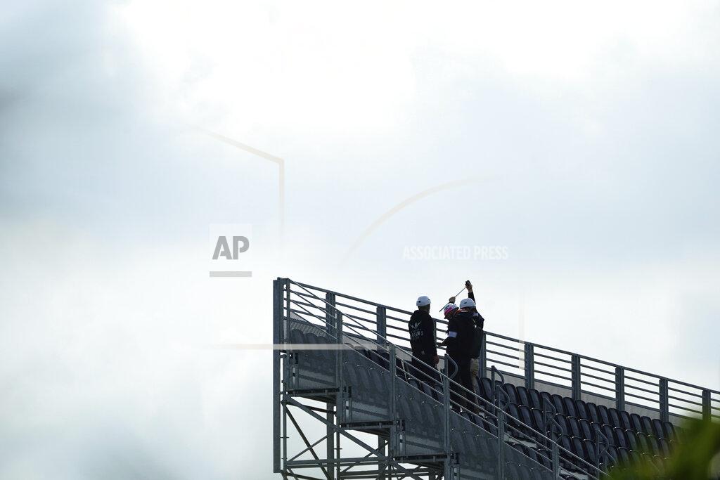 Eugene Hoshiko Workers prepare the venue at Kasai Canoe Slalom Centre for the Tokyo 2020 Olympics Thursday, April 8, 2021, in Tokyo. Many preparations are still up in the air as organizers try to figure out how to hold the postponed games in the middle of a pandemic. (AP Photo/Eugene Hoshiko)