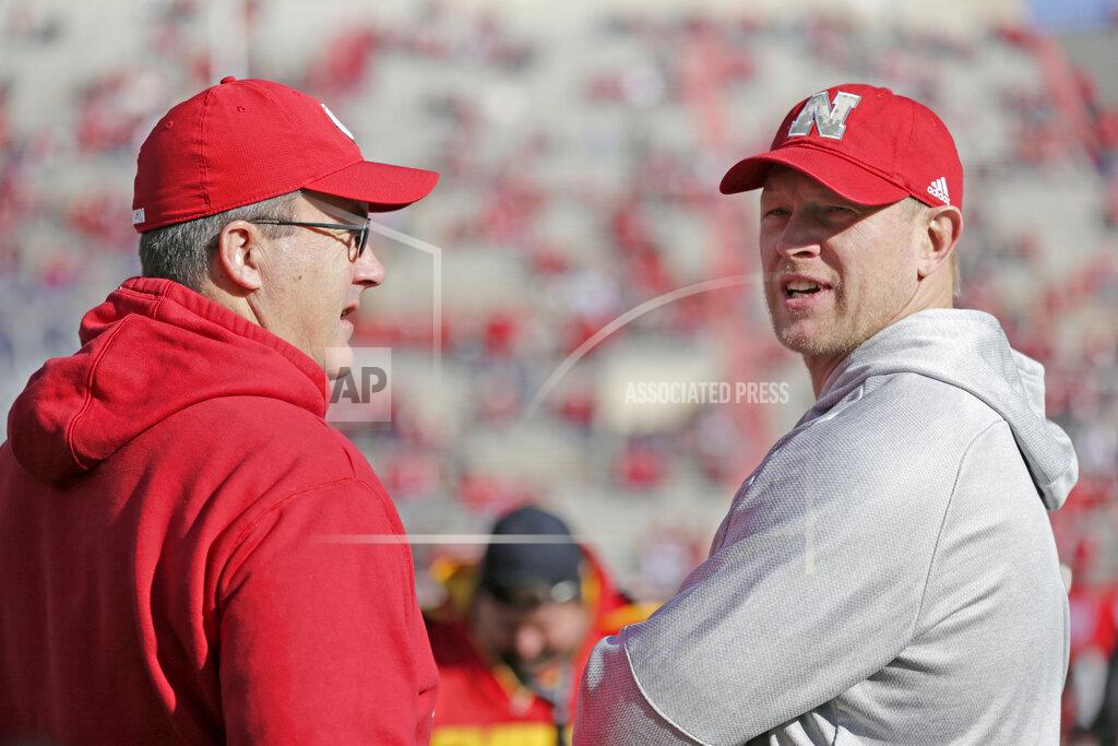 Nati Harnik Nebraska head coach Scott Frost, right, and Wisconsin head coach Paul Chryst talk before an NCAA college football game in Lincoln, Neb., Saturday, Nov. 16, 2019. (AP Photo/Nati Harnik)