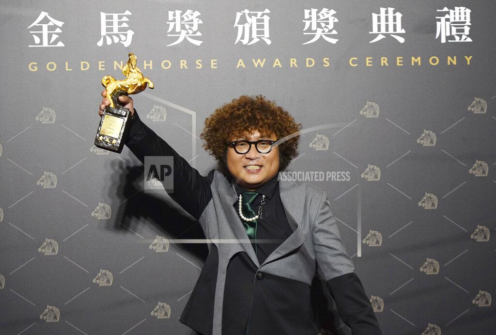 Billy Dai Taiwanese actor Nadow Lin holds his award for Best Supporting Actor at the 57th Golden Horse Awards in Taipei, Taiwan, Saturday, Nov. 21, 2020. Lin won for the film "Classmates Minus" at this year's Golden Horse Awards. (AP Photo/Billy Dai)